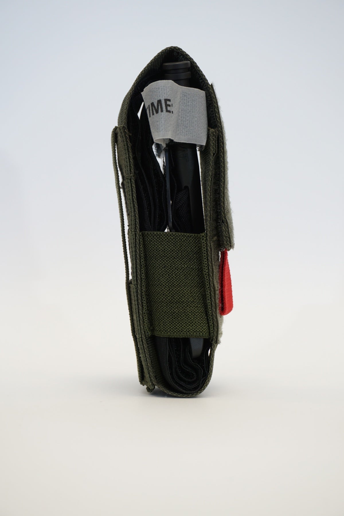 Universalus turniketo (TQ) dėklas